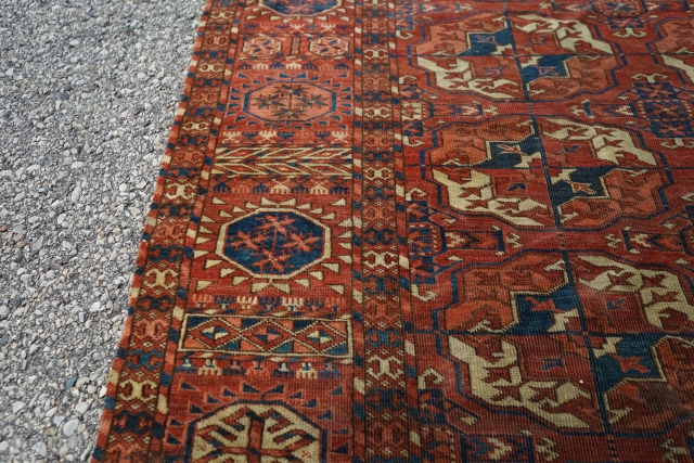 Beautiful 3rd quarter 19th century Tekke main rug. 8ft x 6ft 6in. Unusual minor border and gul. Mostly low pile, one square patch was removed, two tears on one end, and one  ...