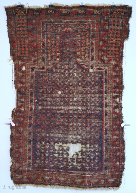 This dukhtar e qazi Baluch prayer rug folds like a cloth and has some of the more intense oxidation I've seen. It's one of the older pieces of this type that I've  ...