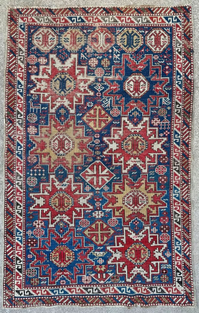 Two row Leshghi star rug. Low pile but an intriguing piece. 3'7" x 5'7" or 110 x 170cm. Contact me at Steven.malloch@gmail.com or gerrerugs@gmail.com for questions or purchase. Cheers!    