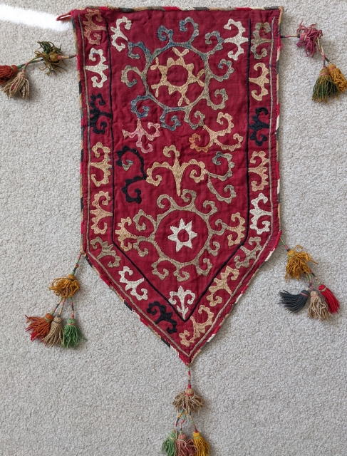 Antique Uzbek Lakai silk embroidered trapping that was used on the end of tent poles. Beautiful piece with original silk tassles.

1'1" x 2'4" (to bottom of the lower tassle)

Cheers.    