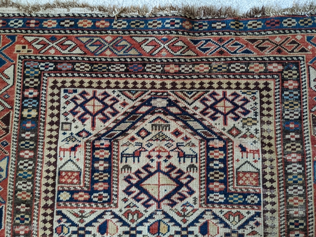 Late 19th century Shirvan prayer rug. 3'4" x 4'10". Has some old fuschine which is now grey. Beautiful colors. No holes, good pile, just the missing edges in some areas. Cheers.  