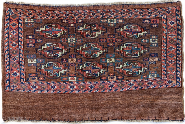 19th century Yomut chuval. Great condition with good saturated, natural colors. Beautiful brown and the back shows it's am old one. 2'5" x 3'8"         