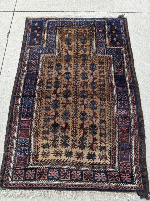 Antique Baluch camel ground prayer rug, possibly Timuri. Tight weave, soft wool with a very floppy handle. Great range of colors. Love the dark blues in this. 3'0 x 4'6".

Cheers   