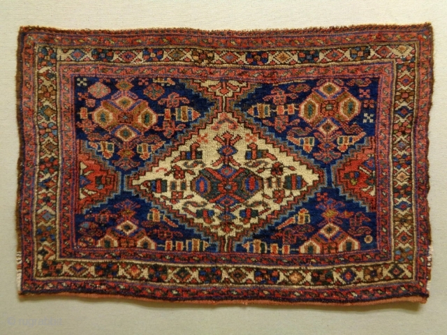 Afshar Bagface
Size: 74x50cm
Natural colors, made in circa 1910/20, there are moth bites at some very small areas.                