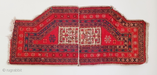 Antique East Turkestan saddle rug made of two pieces stitched together, probably Yarkand. Has very clear Turkemen design elements which is uncommon. Size is 120x54 cm (47×21 inches).     