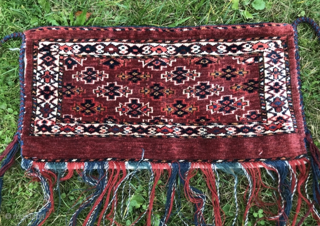 Lovely small Turkoman Yomud group torba or mafrash. With full backside and tassels. Uncommon border. Natural dyes. In great condition. Size is 29 x 58 cm.       