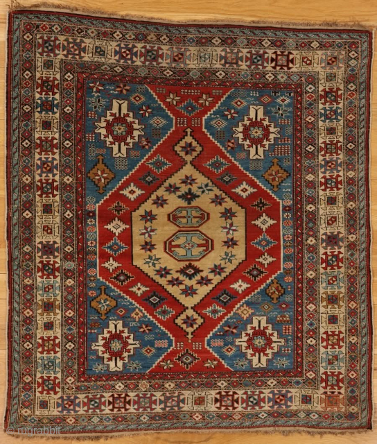 Konagkend rug from Kuba district,eastern Caucasus,west coast of the Caspian Sea

Age: circa 1860

Size: 4′.6″x4′.0″ (137×122 cm)

This tightly woven Konagkend rug shows a medium blue field with striped ivory medallions in the corners  ...