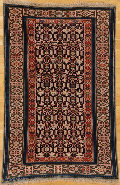 Konagkend rug from Kuba district, eastern Caucasus, Caspian region 

Age: circa 1875

Size: 5′.1″x3′.4″ (155×102 cm)

This very fine Kuba district rug shows a close variety of the characteristic ivory arabesque lattice overall pattern  ...