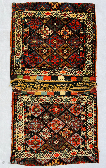 Magnificent Varamin Khoorjin circa 1880 With very beautiful animals woven on both sides and looking towards the center., the field is covered in a diamond lattice containing cruciform designs with natural saturated  ...