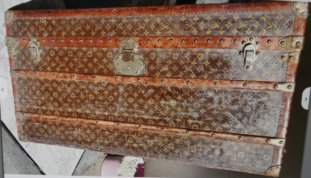 Authentic LOUIS VUITTON Monogram Steamer Trunk.  Manufactured in France over a hundred years ago. Instantly recognized by the famous monogram adorning all sides. Brass hardware and wheels, canvas, and leather trim.  ...