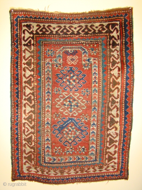 Small Caucasian Kazak Prayer rug. 35"X50"....90X128 Cm. A few small holes and crease wear as shown. Better pile in the border area. All original sides and ends.      