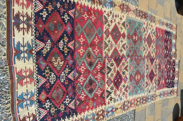 Anatolia or Northern Persia Kilim (?), beautiful colors, in nice condition, though the two panels don't match up very well.  Measures 11' 6" at its longest x 5' wide.  Nice  ...