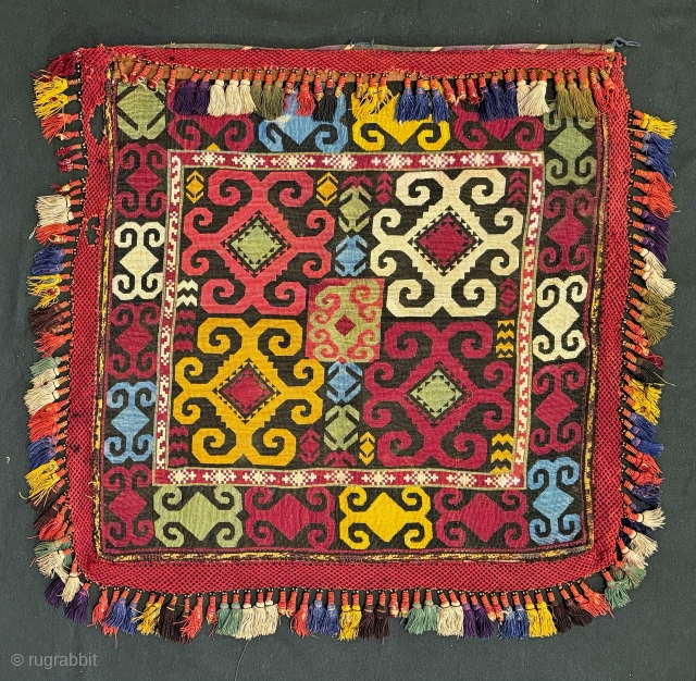 A dazzling Antique Uzbek cross stitched silk embroidery made by the Lakai Tribe of Central Asia. It dates the late 19th Century and is known as Ilgich. Such textiles were embroidered as  ...