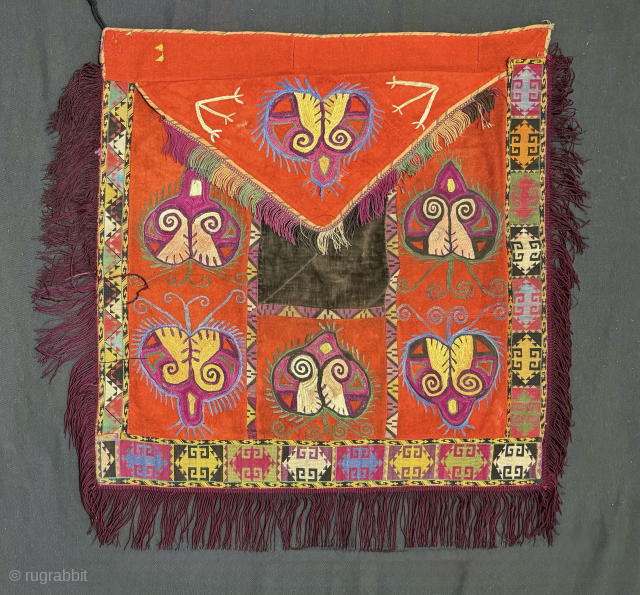 An excellent antique Uzbek Lakai tribe silk embroidery known as Ilgich / Ayna Khalta. Dating to the late 19th century. It is envelope shaped with a false flap, often assumed to be  ...