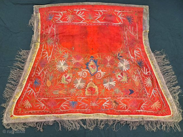 a lovely antique Uzbek Lakai silk embroidered horse blanket / saddle cover. This lovely ethnographic embroidery dates to the late 19th century and is polychrome silk chain stitched embroidery on red wool  ...