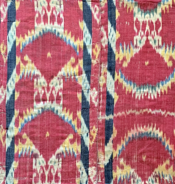 An exceptional Antique early to mid 19th century Uzbek Adras Ikat quilted hanging from Bokhara / Bukhara region. It is a haft rang / seven colour Ikat which is considered the highest  ...