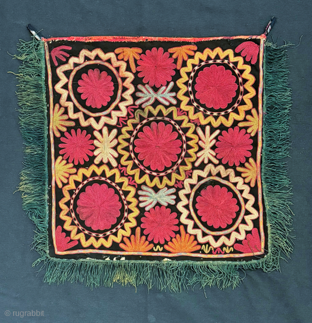 Flowers and fireworks. An antique Uzbek Lakai tribe silk embroidered talismanic ilgich hanging dating to the 19th century. These bridal embroideries were made as dowry offerings and hung on yurts / tents  ...