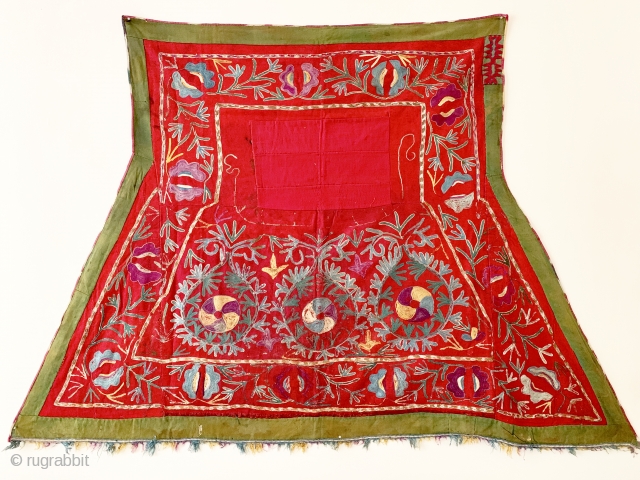 A lovely antique Uzbek Lakai silk embroidered horse blanket / saddle cover. This lovely ethnographic embroidery dates to the late 19th century and is polychrome silk chain stitched embroidery on red wool  ...