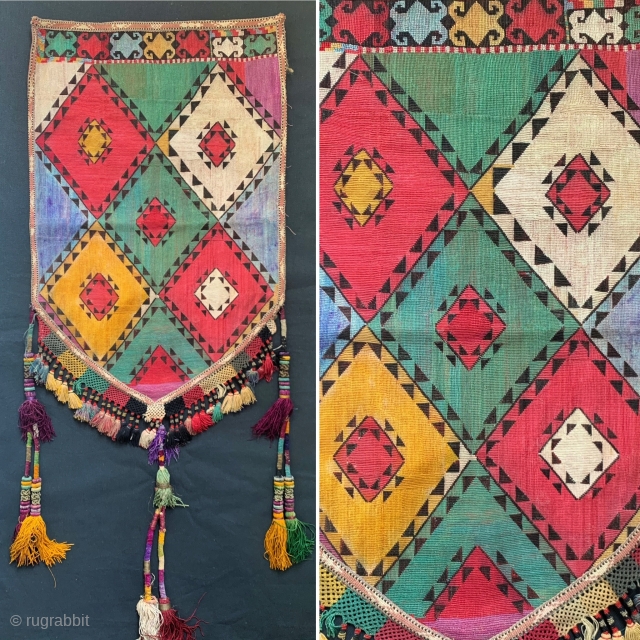 An excellent example of Antique Uzbek Lakai tribe silk cross stitched shield shaped talismanic hanging known as Uut Kap Ilgich, dating to the 19th century. This is one of the coveted examples  ...