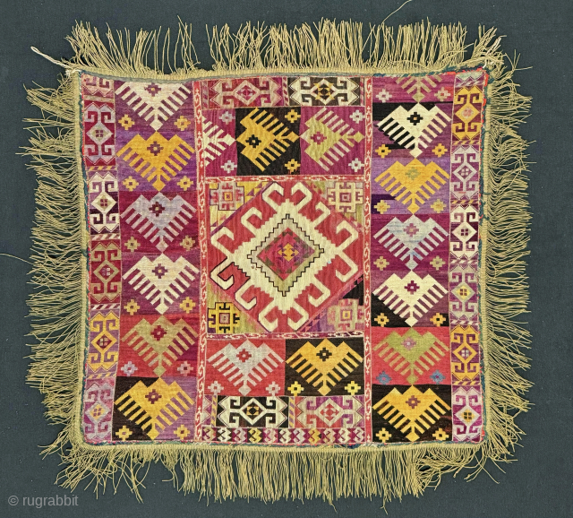 A dazzling Antique Uzbek cross stitched silk embroidery made by the Lakai Tribe of Central Asia. It dates around late 19th Century and is known as Ilgich. Such textiles were embroidered as  ...