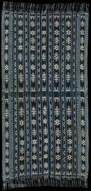 Ikat shawl from Savu island, Indonesia. Period 1940-1950. Excellent weaving. Hi'i worapi, man's wrap with classic boda and moto (star) motifs in white on indigo background. Price includes economy shipping worldwide.  