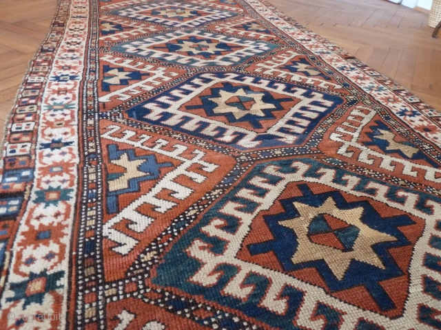 A vibrant Karabagh Kazak, late 19th Century. 258 x 110 cm. The ends are rewoven and there is some old repiling, but overall in good condition.       