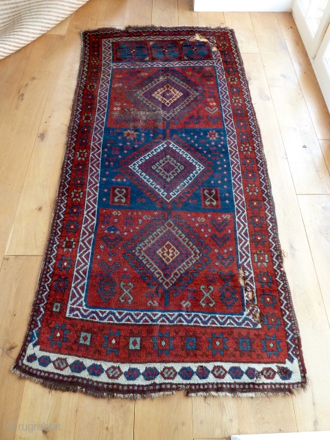 A good 19th Century Shavak anatolian rug, with lustrous wool and saturated natural colours. Damaged as seen - needs washing and conservation/repair. 240 x 108 cm.       