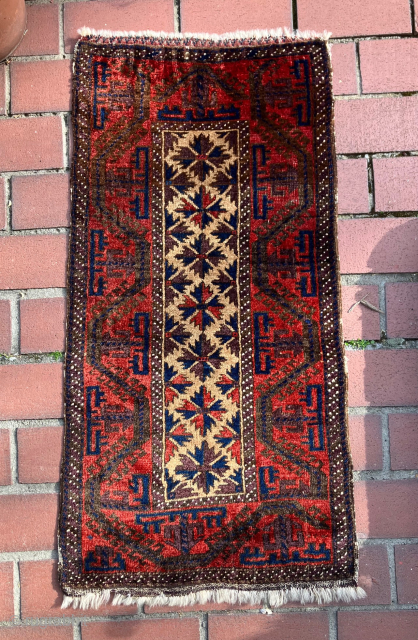 Baluch balisth.  Great border and lustrous wool and good dyes.  Excellent symmetry.  This one satifies.  Size: 19 x 37 inches         