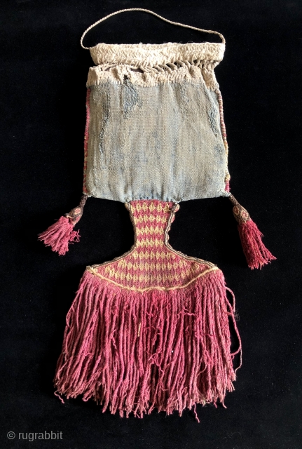 Incan period bag with separately woven pendant fringe.  Native repair made in ancient times.  Blue cotton bag with alpaca fiber pendant, tassels and side finish.  Size: 8 x 20  ...