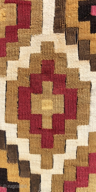 Very beautifully woven Pre-Columbian slit tapestry strip.  Chimu Culture, Peru.  A.D. 1000 - 1400.  The textile has been sewn to a black backing cloth and attached to a frame  ...