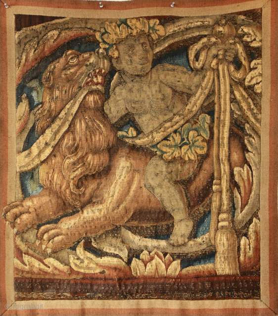 17th century Flemish tapestry fragment, 2'1" x 2'5" / 64 x 74cm
A cherub sitting on the back of an extremely expressive lion. Great image.         