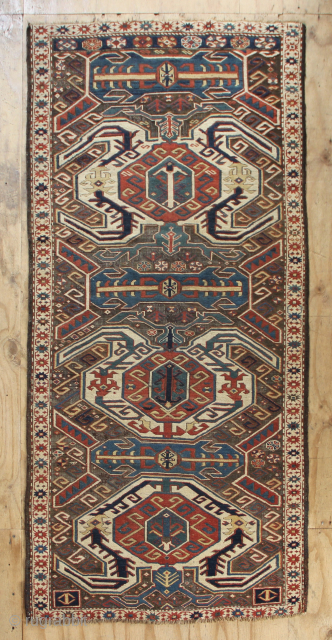 Late 19th century Lenkoran, Caucasus, 128 x 282cm / 4'3" x 9'3" 
Corroded black field has been re-wefted amateurishly but adequately, in places. Ends secured and floor ready. All natural dyes.  