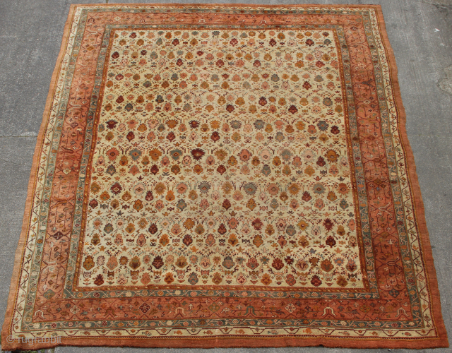 19th century fine antique Oushak carpet, in showroom condition 12'6" x 16'6" with creamy ground colour and abstract floral design in soft colours.          