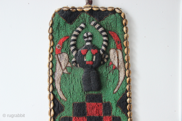 African beadwork, circa 1950 (?)
Beautiful colour and incredible work, with small coloured glass beads and seashells embroidery onto a piece of leather. Very striking art. 25 x 143cm
Please contact me directly at  ...