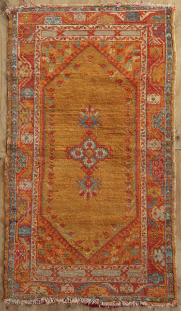 Antique Kula Oushak rug 80 x 153cm / 3'0" x 5'4"
Missing ends and with a light sprinkling of moth damage             