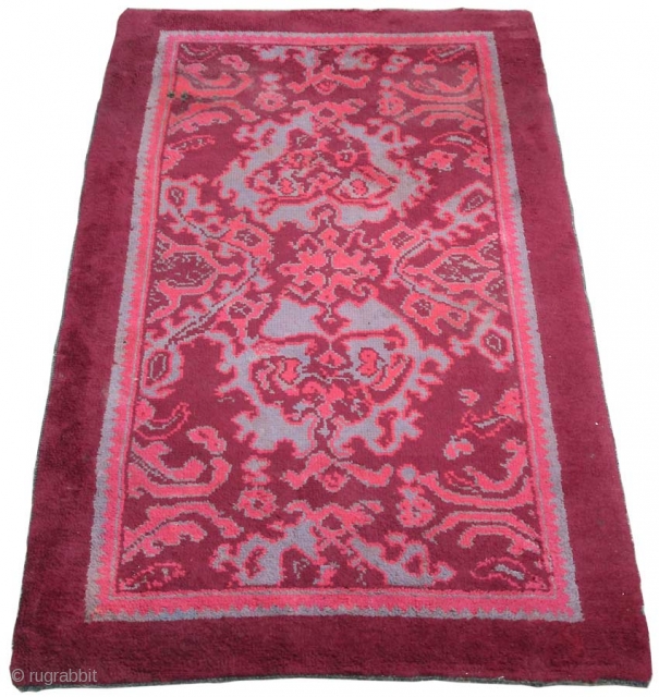 British rug, maroon ground with skeletal design in maroon, maroon-rose and grey; interesting 'neutral' colour palette which is very evocative of the rug's early 20th.century period, (slight 'fleecy' side-to-side band at far  ...