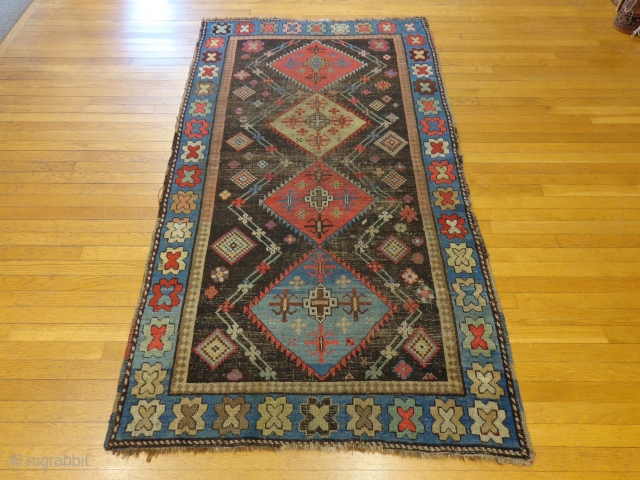 http://lesniakorientalrugs.com/587-caucasian-oriental-rug-3-10-x-7-dark-brown-karabagh.html

This stunning antique Caucasian Karabagh rug is in fair condition. The design features three center medallions set in a very dark brown, almost black field surrounded by bright flower and diamond shapes.  ...