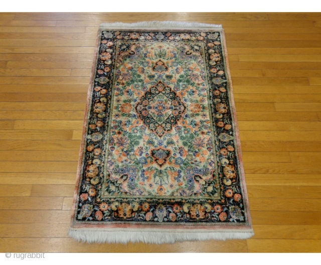 http://lesniakorientalrugs.com/545-persian-oriental-rug-2-8-x-4-4-pink-silk-qum.html

This Persian Qum silk rug is in good condition. The field is a cream color with an attractive center medallion. Highlight colors include green, pink and black. There is minor wear on  ...