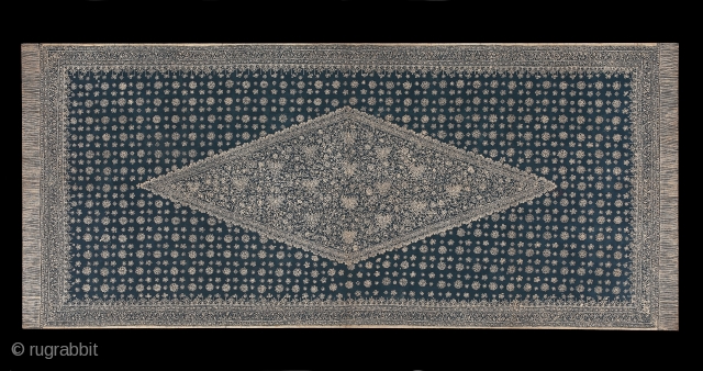 TE00606
1920-40s Kudhung Batik Tulis Bersidang, woman's head shawl, cotton with hand drawn wax resist white on blue ground  pattern of a large central lonzenge (Tengahan)  filed with stylized small lotuses  ...