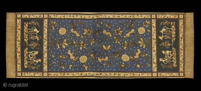 TE02321
1930-40s Selendang Batik Tulis, shawl, cotton hand drawn wax resist pattern of flowers on a bright blue ground with wayang kulit figures on a dark green ground at the end panels and  ...