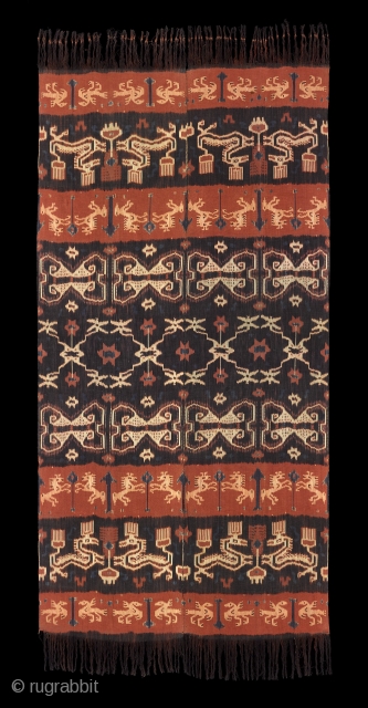 TE02382

1960s Hinggi Kombu, man's ceremonial shoulder wrap, cotton alternating orange and dark brown bands with warp Ikat rows of horses and mythical beasts with large patola ratu band in center. Natural dyes.  ...