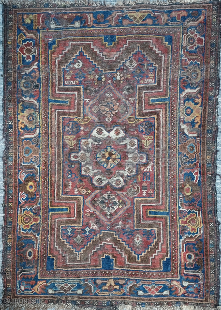 Antique Khamseh small rug, 31 x 44 inches. Probably late 19th / early 20th century. Decent condition showing moderate wear, a couple of small holes stabilized by patch sewn on verso. Original  ...