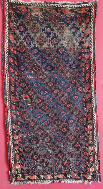 Early Baluch rug with small ashik guls and a true aubergine. Damaged areas backed with kilim pieces sewn on verso. Published piece from a Budapest collection. USD 550.- includes shipping in the  ...