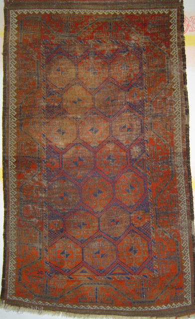 Early Baluch Guls in Hexagon lattice small rug with heavy even wear. Viewed on the verso it can be enjoyed as a flatweave. USD 325.- includes shipping in the U.S. Please check  ...