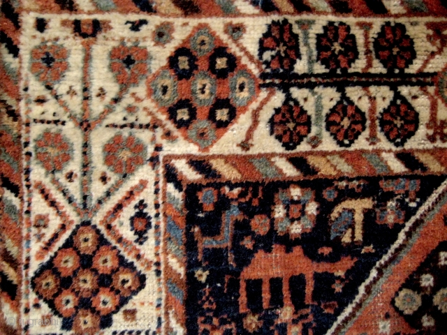 Small South Persian rug, probably Khamseh, with many intriguing features, including camels and a very attractive border. End losses and some ground showing, but overall in good condition. 1.40 x 1.08 m. 