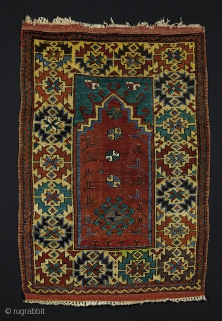 Central Anatolian Prayer Rug, circa 1900, 3' 2'' x 4' 5'', natural and synthetic dye mix.  Bold drawing, good pile condition.           