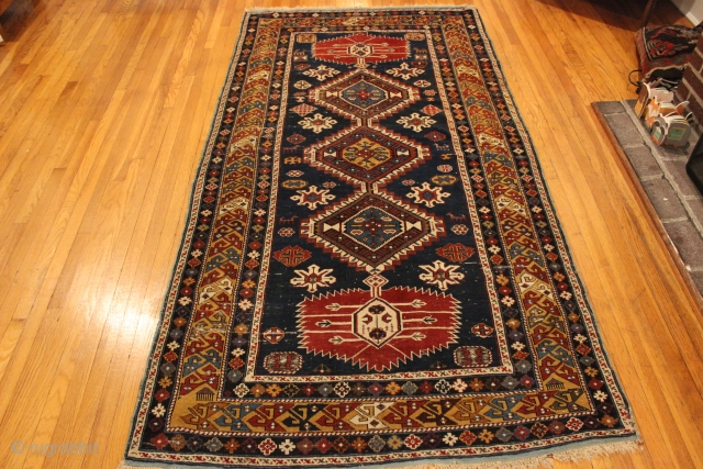 1870s Caucasian Shirvan.  4'2'' x 8'4''. Well drawn example.  Some wear and repair.  Natural colors. 

Ebay Item # https://www.ebay.com/itm/143500147907           