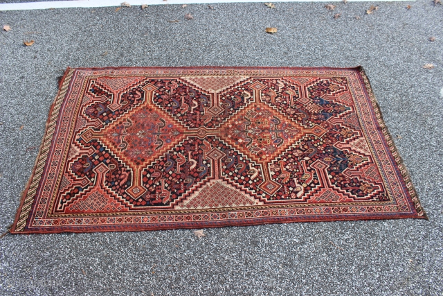 South Persian late 19th century 3'7'' x 6'0''.  Probably Khamseh.  Pile is worn low and even.  Slightly irregularly shaped with one end about two inches wider than the other.  ...