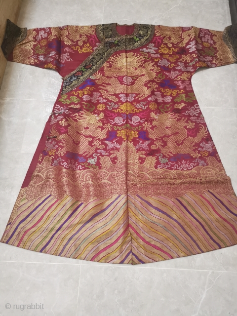 The red and multicolored brocade Dragon Robe of the Qing Dynasty.

It's clean, beautiful and undamaged.                  