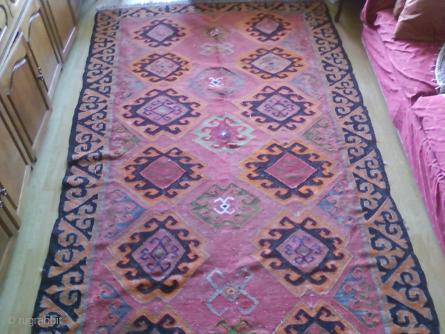 Kilim supposedly woven after WWII in Kazakhstan by people from Caucasus. Outer border design is common in artefacts from Kazakhstan but it is surprisingly based on silk. comments welcomed.    